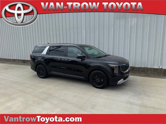 2025 Kia Carnival LXS in Aurora Black Pearl — front three-quarter view