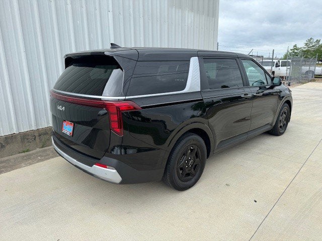 2025 Kia Carnival — rear three-quarter view